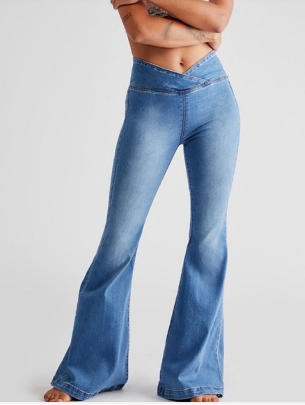 We The Free Light Blue Crossover Waist Flare Jeans